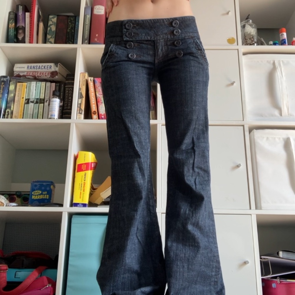 Low rise flare jeans with button waist detail